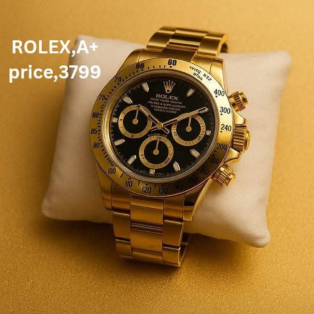 Gold Rolex watch on a white cushion with a yellow background